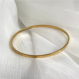 Classic_Flat_Stackable_Bangle_on Material